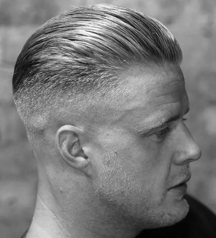 Classic slick back with a fade by Youssef Ouda in Montreal