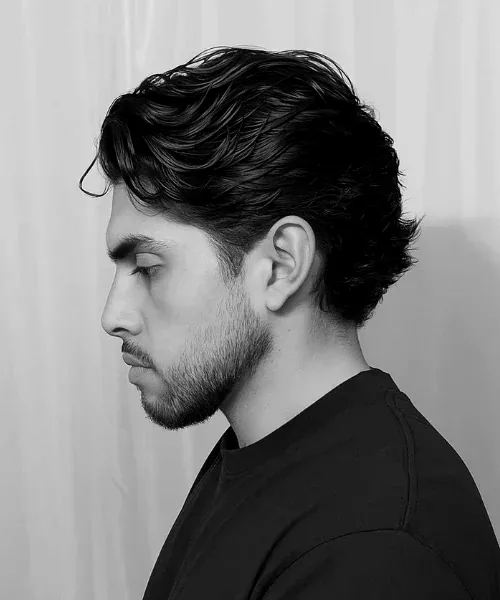 Swept-back flow haircut by Youssef Ouda