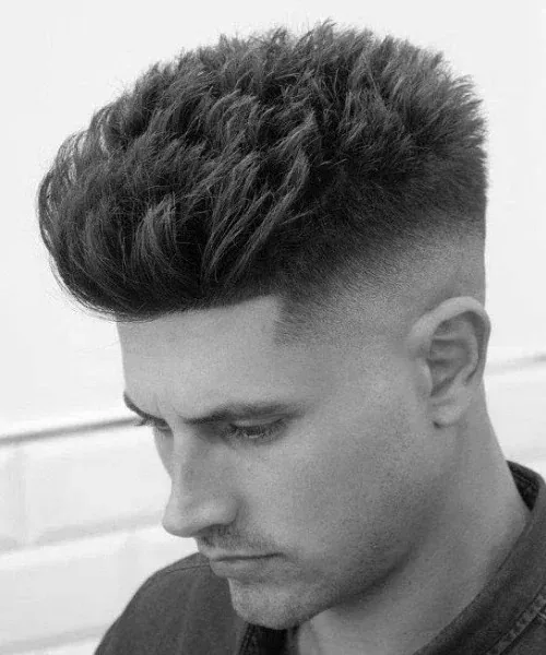 Voluminous quiff with a fade by Youssef Ouda
